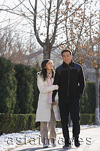 Asia Images Group - Young couple walking in park