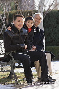 Asia Images Group - Grandfather, son and grandson in the park