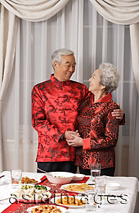 Asia Images Group - Elderly couple in traditional clothing looking at each other