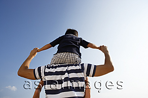 Asia Images Group - Father piggybacking son