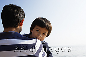 Asia Images Group - Father carrying son