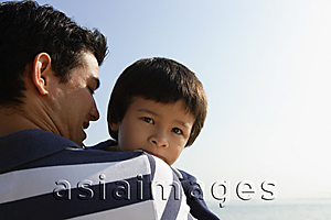 Asia Images Group - Father carrying son