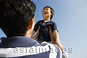 Asia Images Group - Father picking up son