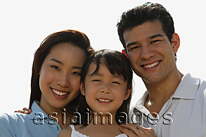 Asia Images Group - Young parents with daughter, looking at camera