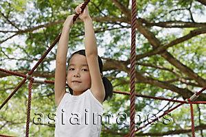 Asia Images Group - Young girl playing at the park, looking at camera