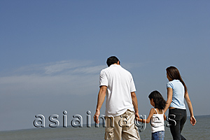Asia Images Group - Family holding hands, walking down the beach