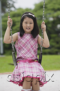 AsiaPix - Girl on swing, smiling at camera