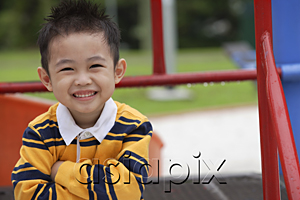AsiaPix - Young boy in striped shirt, smiling at camera