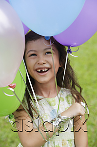 AsiaPix - Young girl with several balloons, smiling