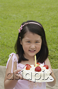 AsiaPix - Girl holding birthday cake with one candle