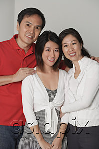 AsiaPix - Family of three, looking at camera, smiling