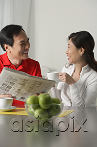 AsiaPix - Mature couple at home having coffee