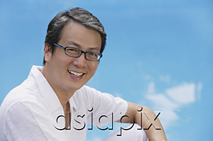 AsiaPix - Man in white shirt smiling at camera