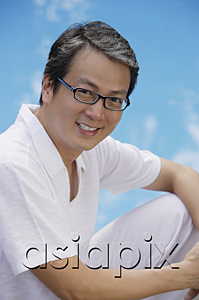 AsiaPix - Man in white shirt and spectacles, smiling at camera