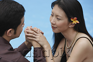 AsiaPix - Couple holding hands, looking at each other