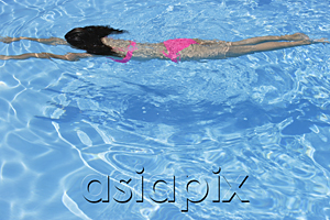 AsiaPix - Woman swimming in pool