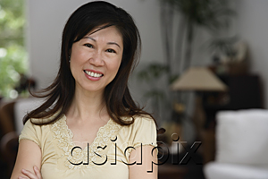 AsiaPix - Woman at home, smiling at camera, head shot