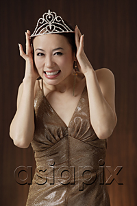 AsiaPix - woman wearing crown, holding crown on head, smiling