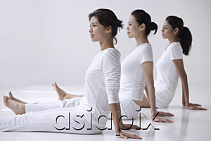 AsiaPix - three women of mixed race sitting with legs outstretched, side view