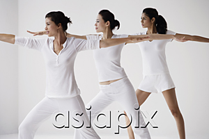 AsiaPix - Three woman in lunge posture, yoga