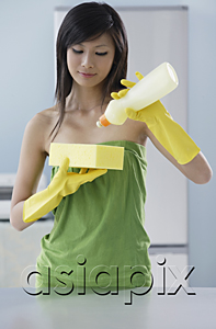 AsiaPix - woman in kitchen, squeezing soap onto sponge, cleaning