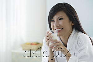 AsiaPix - woman holding glass of milk, smiling