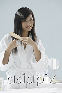 AsiaPix - woman in bathrobe, brushing hair and smiling