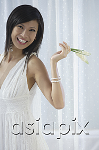 AsiaPix - woman in white dress holding flowers and laughing, smiling