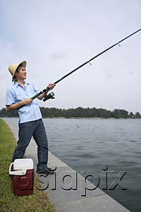 AsiaPix - Man fishing with fishing pole