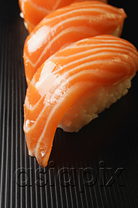 AsiaPix - three pieces of salmon sushi, nigiri on rice ball