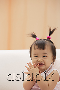 AsiaPix - Baby Girl clapping hands and laughing, looking at camera