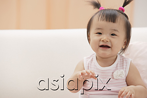 AsiaPix - Baby girl laughing and smiling at camera
