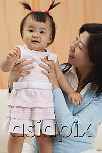 AsiaPix - mother and baby girl, mother looking at girl, girl looking at camera