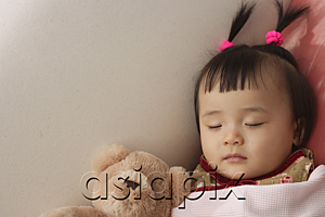 AsiaPix - baby girl sleeping with teddy bear under blanket