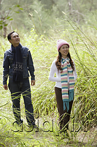 AsiaPix - Man and woman walking through nature, outdoors, hiking