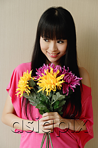 AsiaPix - Young woman holding bouquet of flowers