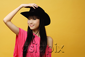 AsiaPix - Young woman wearing black cowboy hat