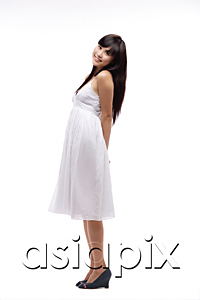 AsiaPix - Young girl wearing white dress, side view