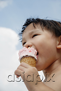 AsiaPix - Young boy eating an ice cream cone