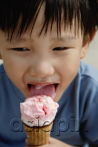 AsiaPix - Young boy eating an ice cream cone