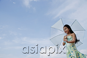 AsiaPix - Young girl holding blue umbrella over head