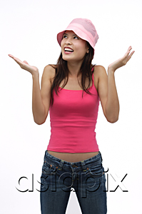 AsiaPix - Young woman wearing pink hat with arms raised up
