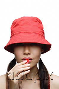 AsiaPix - Girl in red blowing whistle, head shot