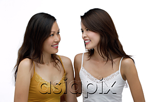 AsiaPix - Two young women looking at each other, smiling