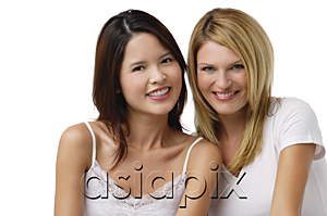AsiaPix - Two young woman wearing white shirts and smiling at camera