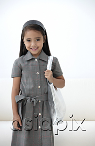 AsiaPix - A young girl dressed in school uniform with a bag