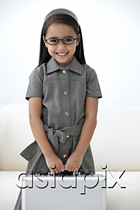 AsiaPix - A young girl dressed in school uniform with glasses