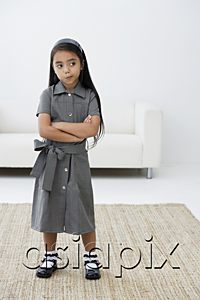 AsiaPix - A young girl dressed in school uniform crosses her arms