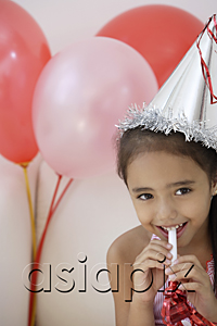 AsiaPix - A young girl at a party with balloons