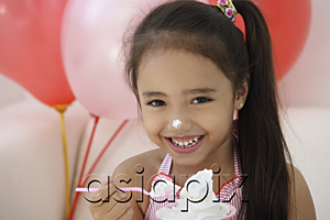 AsiaPix - A young girl at a party with balloons